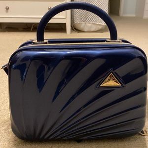 Blue hard shelled case for travel. Great for anything, and especially toiletries